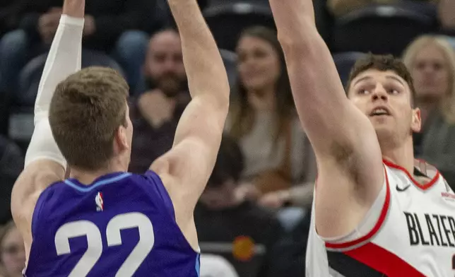 Utah Jazz forward Kyle Filipowski (22) looks to shoot as Portland Trail Blazers center Donovan Clingan, right, defends during the first half of an NBA basketball game Monday, Feb. 24, 2025, in Salt Lake City. (AP Photo/Rick Egan)