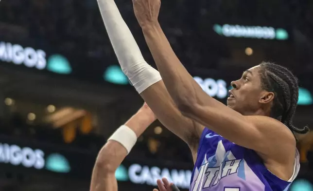 Utah Jazz forward Cody Williams (5) looks to shoot as Portland Trail Blazers forward Toumani Camara (33) defends in the first half of an NBA basketball game Monday, Feb. 24, 2025, in Salt Lake City. (AP Photo/Rick Egan)