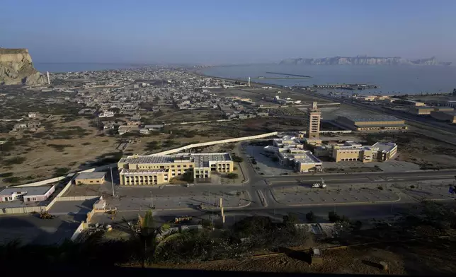 A view of newly developing area, bottom, and downtown area seen from a hilltop in the coastal city of Gwadar, in the southwest Pakistani province of Balochistan, Jan. 14, 2025. (AP Photo/Anjum Naveed)