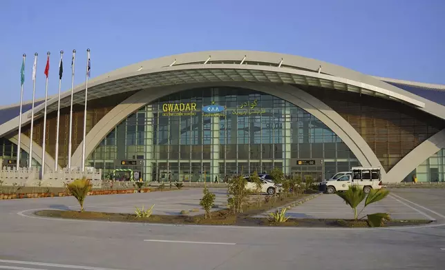 This Jan. 10, 2025, photo provided by Pakistan Airports Authority on Friday, Feb. 21, 2025, shows security forces officials outside the newly constructed Gwadar airport, in Pakistan. (Pakistan Airports Authority via AP)