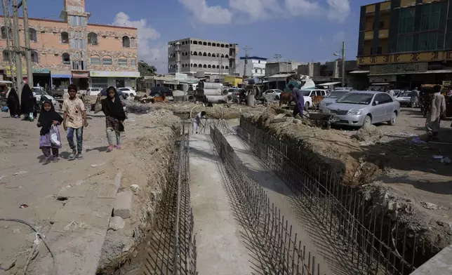 Workers at the construction site of a drainage system by the local government in the coastal city of Gwadar, in the southwest Pakistani province of Balochistan, Jan. 13, 2025. (AP Photo/Anjum Naveed)