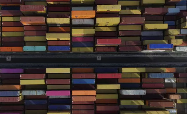 Shipping containers wait to be processed at London Gateway port, in Stanford-le-Hope, on the Thames estuary east of London, England, Wednesday, Feb. 5, 2025. (AP Photo)