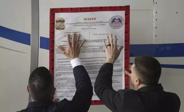 A "seized" sign is placed on a Venezuelan government airplane during a news conference where U.S. Secretary of State Marco Rubio announced its seizure at La Isabela International Airport in Santo Domingo, Dominican Republic, Thursday, Feb. 6, 2025. (AP Photo/Mark Schiefelbein, Pool)