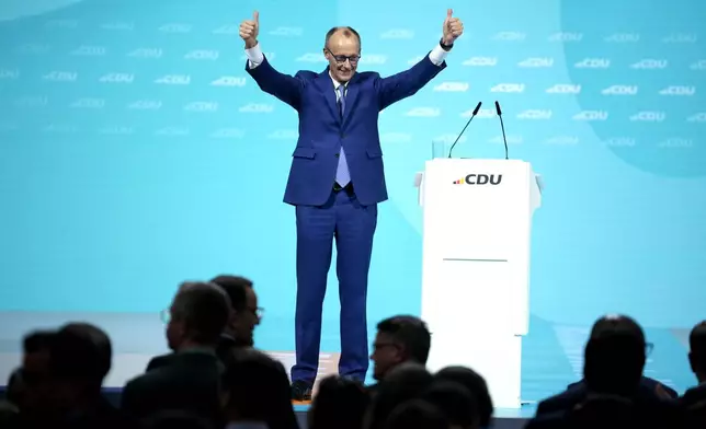 Friedrich Merz, CDU candidate for chancellor and CDU federal chairman,celebrates after his speech at the 37th federal party conference of the CDU in Berlin, Germany, Monday, Feb.3, 2025. (AP Photo/Ebrahim Noroozi)