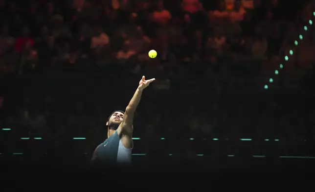 Spain's Carlos Alcaraz serves against Australia's Alex de Minaur during the final match of the ABN AMRO Tennis Tournament in Rotterdam, Netherlands, Sunday, Feb. 9, 2025. (AP Photo/Peter Dejong)