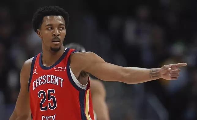 New Orleans Pelicans guard Trey Murphy III gestures to teammates in the first half of an NBA basketball game against the Denver Nuggets, Wednesday, Feb. 5, 2025, in Denver. (AP Photo/David Zalubowski)
