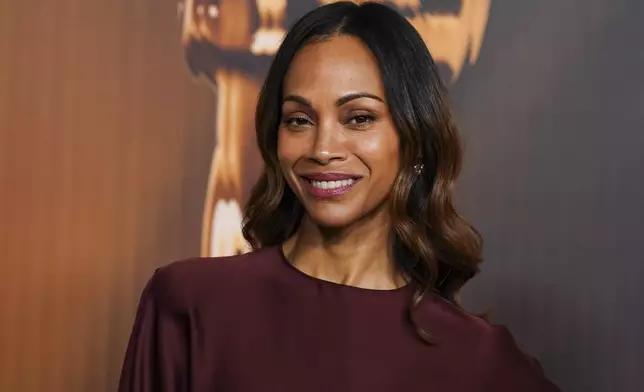 Zoe Saldana arrives at the Oscars Nominees Dinner on Tuesday, Feb. 25, 2025, at the Academy Museum of Motion Pictures in Los Angeles. (Photo by Jordan Strauss/Invision/AP)
