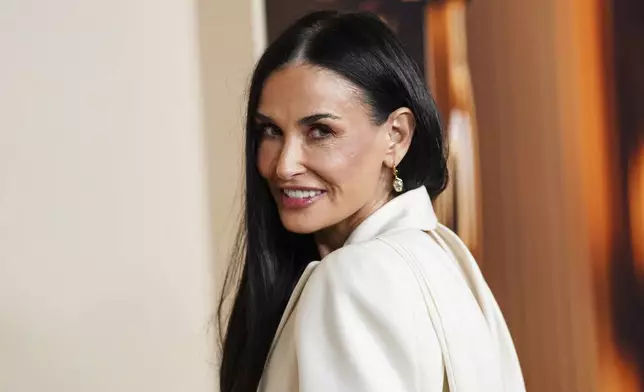 Demi Moore arrives at the Oscars Nominees Dinner on Tuesday, Feb. 25, 2025, at the Academy Museum of Motion Pictures in Los Angeles. (Photo by Jordan Strauss/Invision/AP)