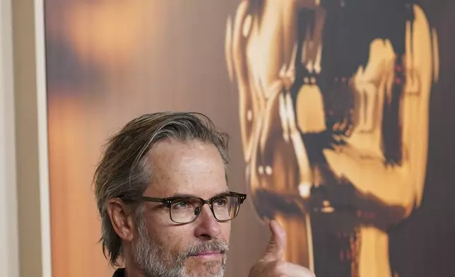 Guy Pearce arrives at the Oscars Nominees Dinner on Tuesday, Feb. 25, 2025, at the Academy Museum of Motion Pictures in Los Angeles. (Photo by Jordan Strauss/Invision/AP)
