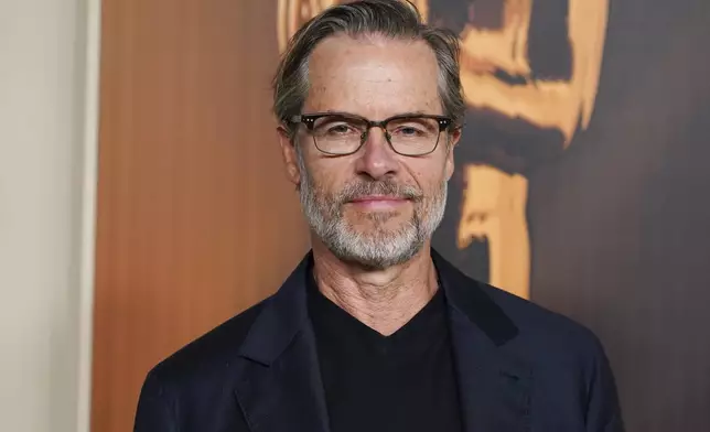 Guy Pearce arrives at the Oscars Nominees Dinner on Tuesday, Feb. 25, 2025, at the Academy Museum of Motion Pictures in Los Angeles. (Photo by Jordan Strauss/Invision/AP)