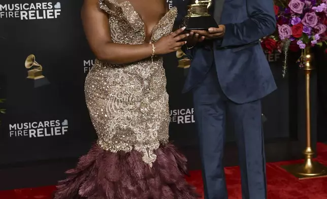 Tarriona 'Tank' Ball, left,and Norman Spence, of Tank and the Bangas pose in the press room with the award for best spoken word poetry album during the 67th annual Grammy Awards on Sunday, Feb. 2, 2025, in Los Angeles. (Photo by Richard Shotwell/Invision/AP)