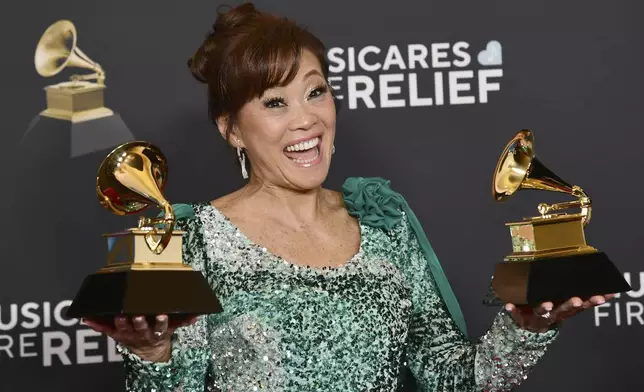 Mimy Succar poses in the press room with the award for best tropical latin album for "Alma, Corazon y Salsa" and best global music performance during the 67th annual Grammy Awards on Sunday, Feb. 2, 2025, in Los Angeles. (Photo by Richard Shotwell/Invision/AP)
