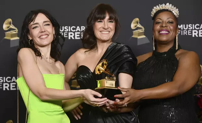 Erin Bentlage, from left, Sara Gazarek and Johnaye Kendrick, winners of best arrangement, instruments and vocals award for "Alma", pose in the press room during the 67th annual Grammy Awards on Sunday, Feb. 2, 2025, in Los Angeles. (Photo by Richard Shotwell/Invision/AP)