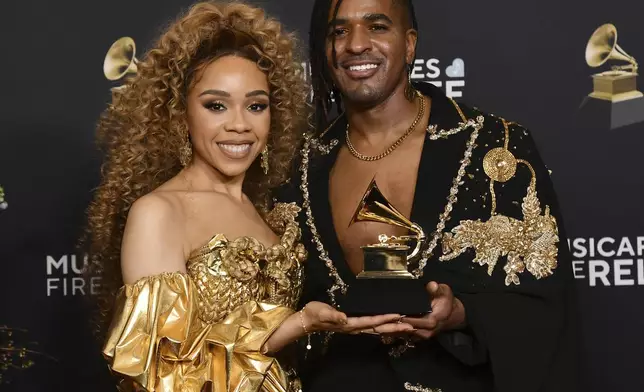 Angela V. Benson, left, and Matt B pose in the press room with the award for best global music album for "Alkebulan II" during the 67th annual Grammy Awards on Sunday, Feb. 2, 2025, in Los Angeles. (Photo by Richard Shotwell/Invision/AP)