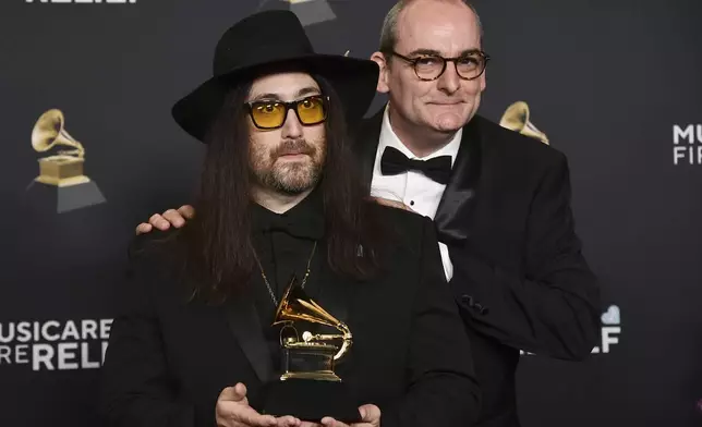 Sean Lennon, left, Simon Hilton pose in the press room with the award for best boxed or special limited edition package for "Mind Games" during the 67th annual Grammy Awards on Sunday, Feb. 2, 2025, in Los Angeles. (Photo by Richard Shotwell/Invision/AP)