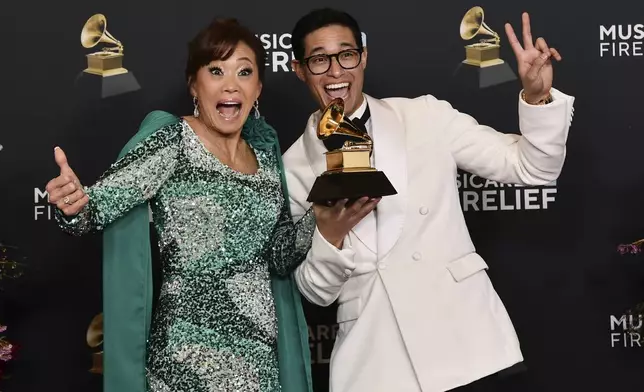Mimy Succar, left, and Tony Succar pose in the press room with the award for best tropical latin album for "Alma, Corazon y Salsa" during the 67th annual Grammy Awards on Sunday, Feb. 2, 2025, in Los Angeles. (Photo by Richard Shotwell/Invision/AP)
