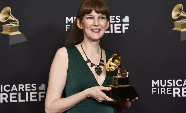 Winifred Phillips, poses in the press room with the award for best score soundtrack for video games and other interactive media for "Wizardry:Proving Grounds of the Mad Overlord", during the 67th annual Grammy Awards on Sunday, Feb. 2, 2025, in Los Angeles. (Photo by Richard Shotwell/Invision/AP)