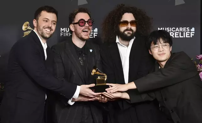 Rob Bisel, from left, Cian Ducrot, Jared Solomon, and Scott Zhang pose in the press room with the award for best r&amp;b song for "Saturn" during the 67th annual Grammy Awards on Sunday, Feb. 2, 2025, in Los Angeles. (Photo by Richard Shotwell/Invision/AP)