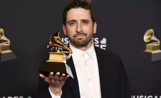Eric Cha-Beach of So Percussion poses in the pressrom with the award for best chamber music/small ensemble performance for "Rectangles and Circumstance" during the 67th annual Grammy Awards on Sunday, Feb. 2, 2025, in Los Angeles. (Photo by Richard Shotwell/Invision/AP)