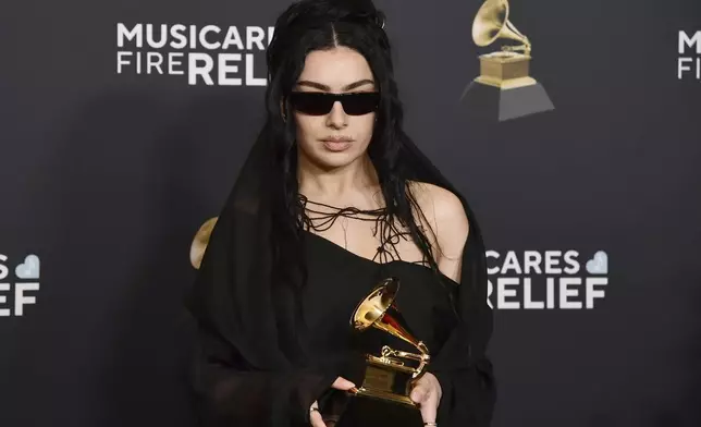 Charli XCX poses in the press room with the award for best pop dance recording for "Von dutch, during the 67th annual Grammy Awards on Sunday, Feb. 2, 2025, in Los Angeles. (Photo by Richard Shotwell/Invision/AP)