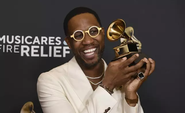 Cory Henry poses in the press room with the award for best roots gospel album for "Church" during the 67th annual Grammy Awards on Sunday, Feb. 2, 2025, in Los Angeles. (Photo by Richard Shotwell/Invision/AP)
