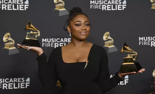 Samara Joy poses in the press room with the award for best jazz performance for "Twinkle Twinkle Little Me" and best jazz vocal album for "A Joyful Holiday" during the 67th annual Grammy Awards on Sunday, Feb. 2, 2025, in Los Angeles. (Photo by Richard Shotwell/Invision/AP)