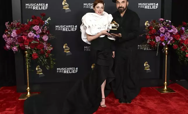 Alisha Gaddis, left, and Lucky Diaz pose in the press room with the award for best children's music album for "Brillo, Brillo! during the 67th annual Grammy Awards on Sunday, Feb. 2, 2025, in Los Angeles. (Photo by Richard Shotwell/Invision/AP)