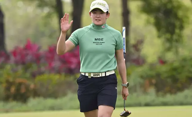 Akie Iwai of Japan reacts on the 16th green during the first round of the LPGA Honda Thailand golf tournament in Pattaya, southern Thailand, Thursday, Feb. 20, 2025. (AP Photo/Kittinun Rodsupan)