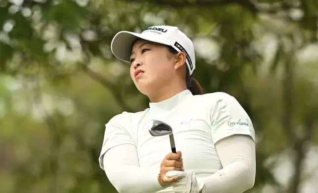 Mao Saigo of Japan watches her tee shot on the first hole of the LPGA Honda Thailand golf tournament in Pattaya, southern Thailand, Thursday, Feb. 20, 2025. (AP Photo/Kittinun Rodsupan)