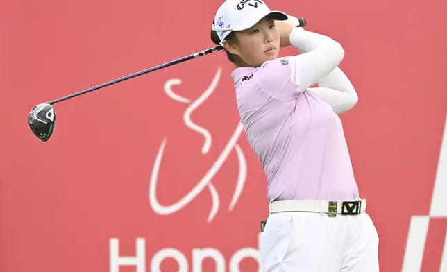 Ruoning Yin of China watches her shot on the 2nd hole during the first round of the LPGA Honda Thailand golf tournament in Pattaya, southern Thailand, Thursday, Feb. 20, 2025. (AP Photo/Kittinun Rodsupan)