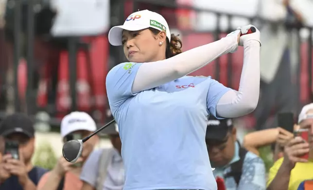 Ariya Jutanugarn of Thailand watches her shot on the 1st hole during the first round of the LPGA Honda Thailand golf tournament in Pattaya, southern Thailand, Thursday, Feb. 20, 2025. (AP Photo/Kittinun Rodsupan)
