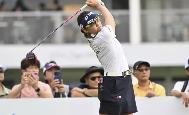 Chisato Iwai of Japan watches her shot on the 1st hole during the first round of the LPGA Honda Thailand golf tournament in Pattaya, southern Thailand, Thursday, Feb. 20, 2025. (AP Photo/Kittinun Rodsupan)