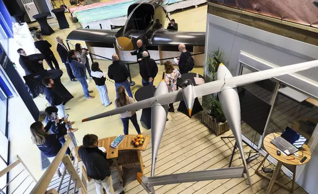 Swiss aviation pioneer Bertrand Piccard speaks about Climate Impulse, a plane powered by liquid hydrogen, at the press presentation of the project in a hangar in Les Sables d'Olonne, France on Thursday, Feb. 13, 2025.(AP Photo/ Yohan Bonnet)