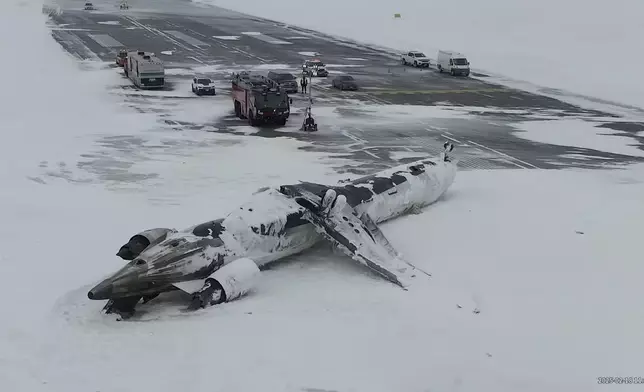 This image taken from video released by the Transportation Safety Board of Canada on Wednesday, Feb. 19, 2025, shows the crashed plane of Delta flight 4819 at Toronto Pearson International Airport, in Mississauga, Ontario, on Tuesday, Feb. 18. (Transportation Safety Board of Canada via AP)