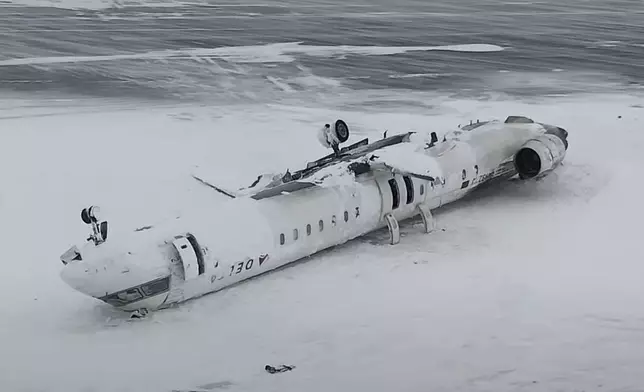 This image taken from video released by the Transportation Safety Board of Canada on Wednesday, Feb. 19, 2025, shows the crashed plane of Delta flight 4819 at Toronto Pearson International Airport, in Mississauga, Ontario, on Tuesday, Feb. 18. (Transportation Safety Board of Canada via AP)