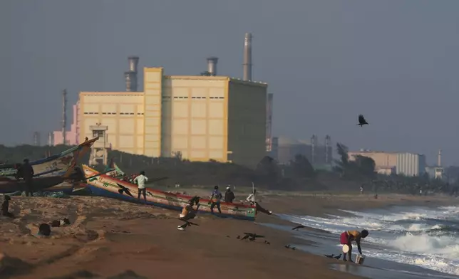 Fishermen park their boats on the shore near the Madras Atomic Power Station located at Kalpakkam, in the Indian state of Tamil Nadu, Monday, Feb. 10, 2025. (AP Photo/ R. Parthibhan)