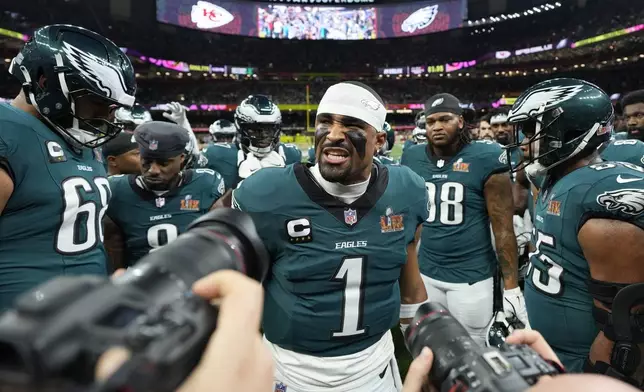 Philadelphia Eagles quarterback Jalen Hurts (1) huddles up his teammates prior to the NFL Super Bowl 59 football game against the Kansas City Chiefs, Sunday, Feb. 9, 2025, in New Orleans. (AP Photo/Brynn Anderson)