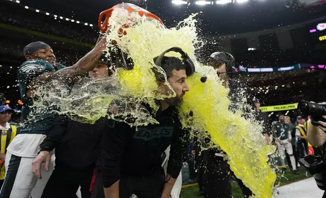 Philadelphia Eagles head coach Nick Sirianni is dunked by teammates during the second half the NFL Super Bowl 59 football game against the Kansas City Chiefs, Sunday, Feb. 9, 2025, in New Orleans. (AP Photo/Matt Slocum)