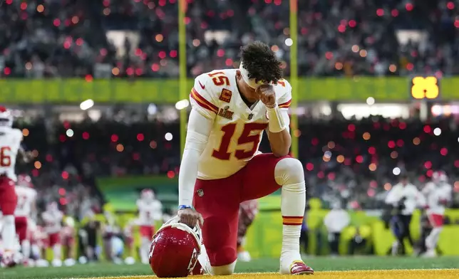 Kansas City Chiefs quarterback Patrick Mahomes takes a knee prior to the NFL Super Bowl 59 football game against the Philadelphia Eagles, Sunday, Feb. 9, 2025, in New Orleans. (AP Photo/Ashley Landis)