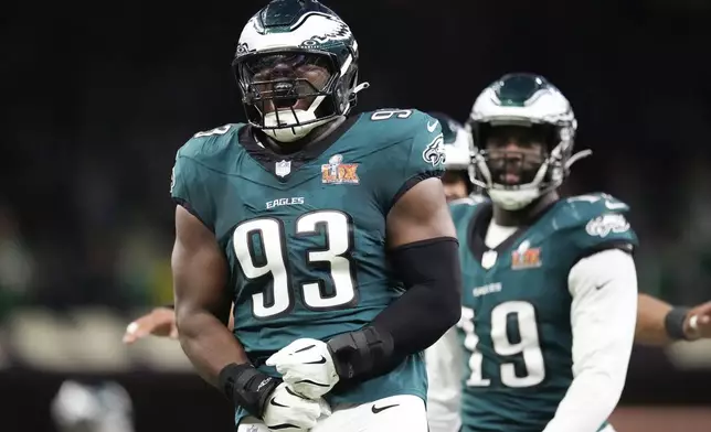 Philadelphia Eagles defensive tackle Milton Williams (93) celebrates after sacking Kansas City Chiefs quarterback Patrick Mahomes (15) during the first half of the NFL Super Bowl 59 football game, Sunday, Feb. 9, 2025, in New Orleans. (AP Photo/George Walker IV)