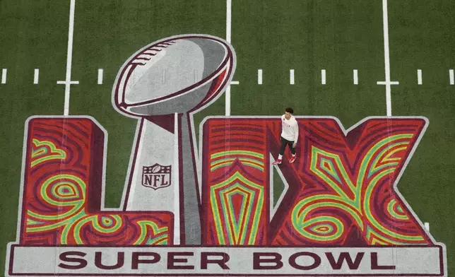 Kansas City Chiefs quarterback Patrick Mahomes walks on the field before the NFL Super Bowl 59 football game against the Philadelphia Eagles, Sunday, Feb. 9, 2025, in New Orleans. (AP Photo/David J. Phillip)