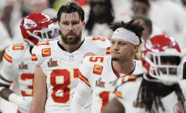Kansas City Chiefs tight end Travis Kelce (87) quarterback Patrick Mahomes (15) and running back Kareem Hunt (29) walk off the field at the halftime break during the NFL Super Bowl 59 football game against the Philadelphia Eagles, Sunday, Feb. 9, 2025, in New Orleans. (AP Photo/Stephanie Scarbrough)