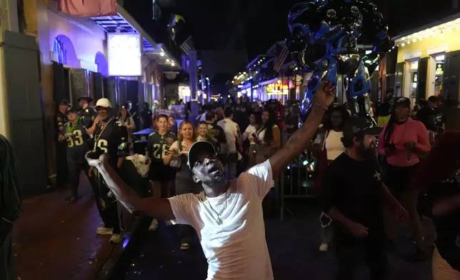 Philadelphia Eagles fans celebrate in the French Quarter after the NFL Super Bowl 59 football game between the Kansas City Chiefs and the Eagles, Sunday, Feb. 9, 2025, in New Orleans. (AP Photo/Julia Demaree Nikhinson)