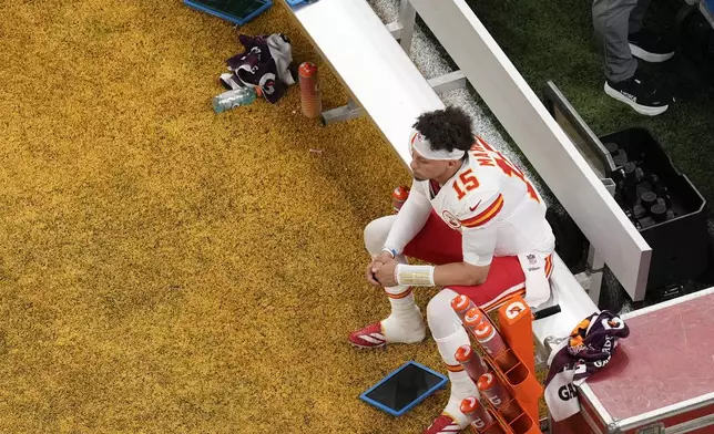 Kansas City Chiefs quarterback Patrick Mahomes (15) sits on the bench during the first half of the NFL Super Bowl 59 football game against the Philadelphia Eagles, Sunday, Feb. 9, 2025, in New Orleans. (AP Photo/David J. Phillip)