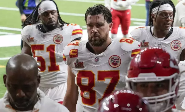 Kansas City Chiefs tight end Travis Kelce (87) leaves the field with teammates after the first half of the NFL Super Bowl 59 football game against the Philadelphia Eagles, Sunday, Feb. 9, 2025, in New Orleans. (AP Photo/David J. Phillip)