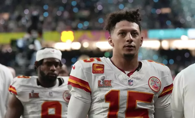 Kansas City Chiefs quarterback Patrick Mahomes (15) and wide receiver JuJu Smith- Schuster (9) walk off the field after a loss to the Philadelphia Eagles during the NFL Super Bowl 59 football game, Sunday, Feb. 9, 2025, in New Orleans. (AP Photo/Abbie Parr)
