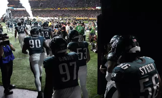 Philadelphia Eagles take the field for the NFL Super Bowl 59 football game against the Kansas City Chiefs, Sunday, Feb. 9, 2025, in New Orleans. (AP Photo/Godofredo A. Vásquez)