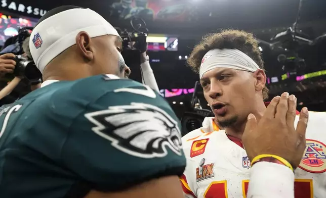 Kansas City Chiefs quarterback Patrick Mahomes, right, greets Philadelphia Eagles quarterback Jalen Hurts after the NFL Super Bowl 59 football game, Sunday, Feb. 9, 2025, in New Orleans. (AP Photo/Brynn Anderson)