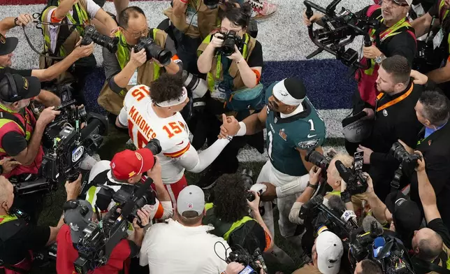 Kansas City Chiefs quarterback Patrick Mahomes (15) and Philadelphia Eagles quarterback Jalen Hurts (1) shake hands after the NFL Super Bowl 59 football game, Sunday, Feb. 9, 2025, in New Orleans. (AP Photo/Godofredo A. Vásquez)