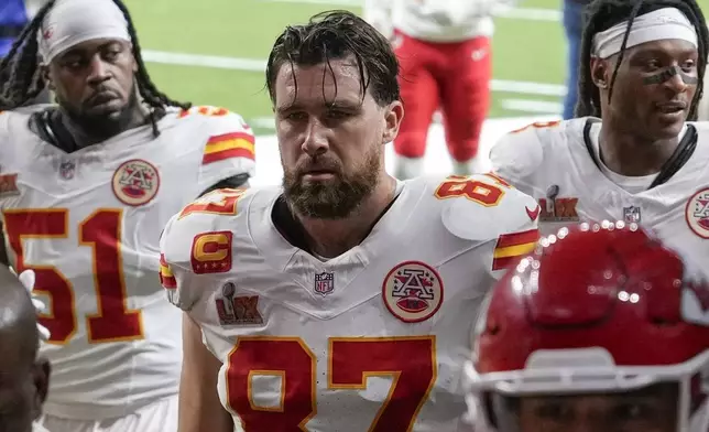 Kansas City Chiefs tight end Travis Kelce (87) leaves the field with teammates after the first half of the NFL Super Bowl 59 football game against the Philadelphia Eagles, Sunday, Feb. 9, 2025, in New Orleans. (AP Photo/David J. Phillip)